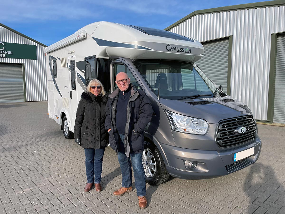David and Dee standing next to Chausson 610 Motorhome