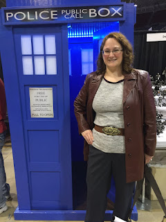 Photo of me in Donna Noble cosplay in front of a TARDIS.