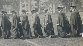 line of students at commencement, some wearing military uniforms