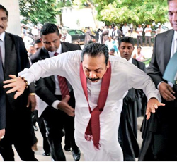 Photo of Mahinda losing his footing in courts premises