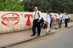 Men walking on the pavement