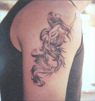 Old School-style mermaid tattoo. Anchors were also popular tattoo motifs at