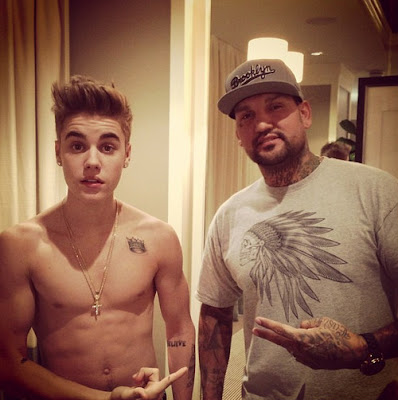 Shirtless Justin Bieber with his New Indian Head Tattoo Artist 2013