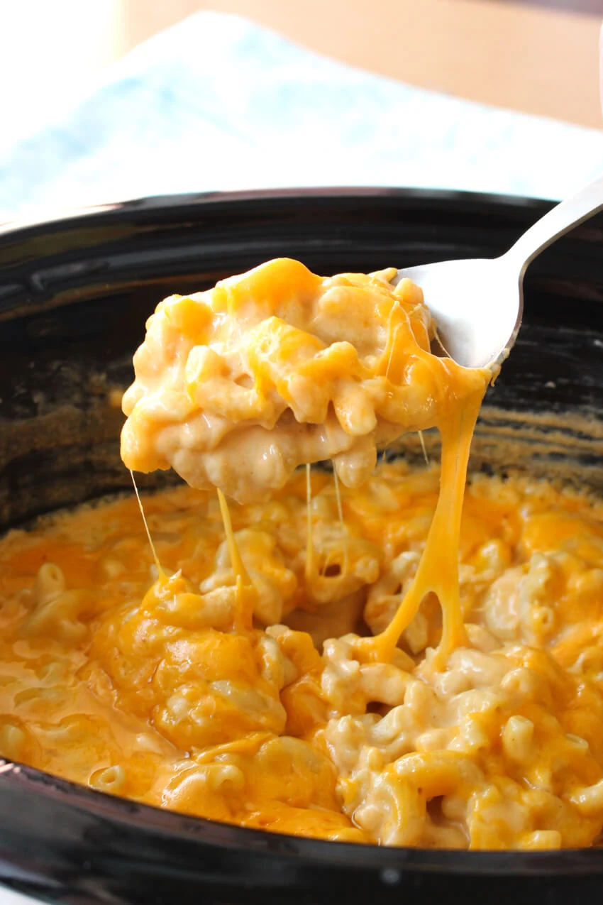 This Creamy Crock Pot Macaroni and Cheese is ultra rich and creamy made with cream cheese, cheddar cheese, and NO canned soups!  #macandcheese #crockpot