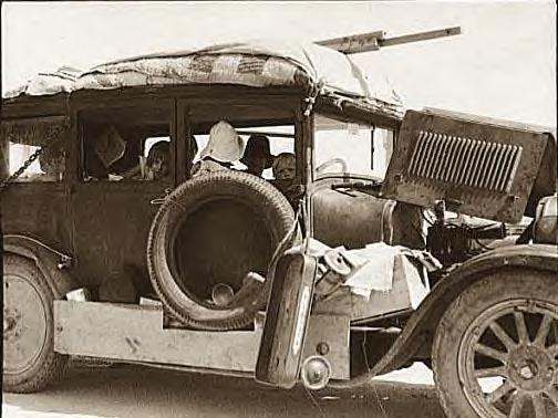 Migrant family stalled on Arizona road going to Ca., 1937 - Photo-1