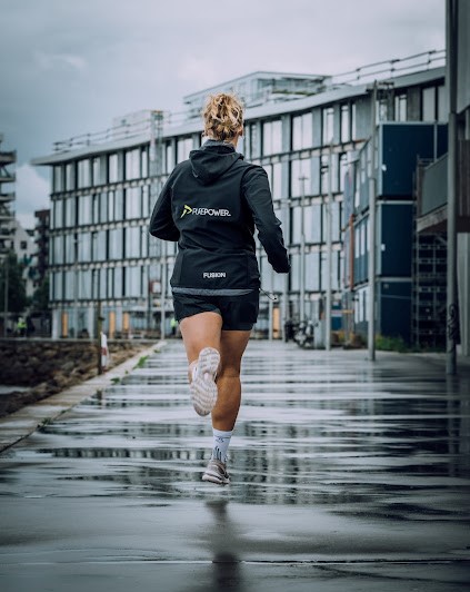 woman running in the rain