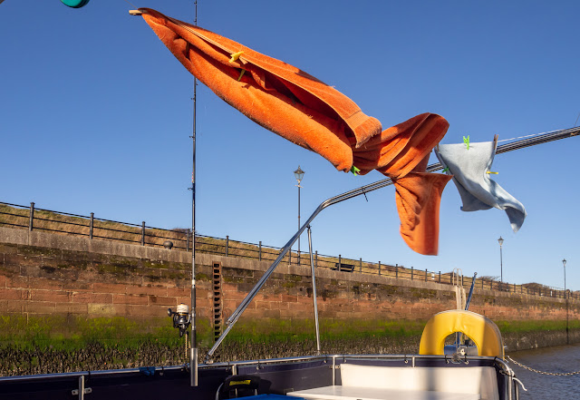 Photo of towels blowing around in the wind on Ravensdale's aft deck on Tuesday