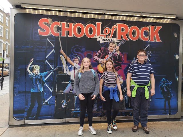 Kids outside school of rock theatre