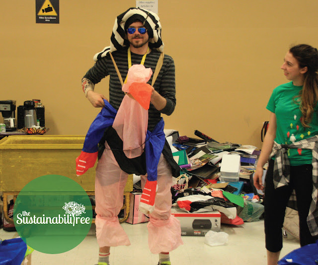 A volunteer dresses up with donations to the Dump and Run