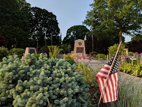 The Franklin Garden Club maintains the flowers beds  around the war memorials on the Town Common