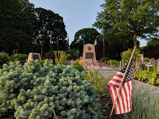 The Franklin Garden Club maintains the flowers beds  around the war memorials on the Town Common