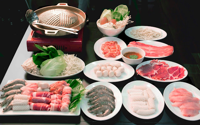 Image of Thai BBQ cooker, enokitake, kailan, fishballs, sliced beef, bacon strips, noodle, cuttlefish, sliced fish, prawns, rolled up meat platter