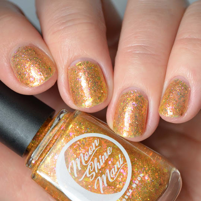 gold flakie nail polish swatch