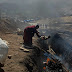 A-Tibet-Monk-Is-Throwing-Baby-Dying-On-Earthquake-To-Fire-Well