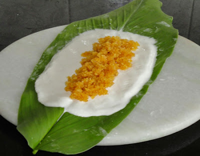 cocnut-jaggery mixture spread on dough