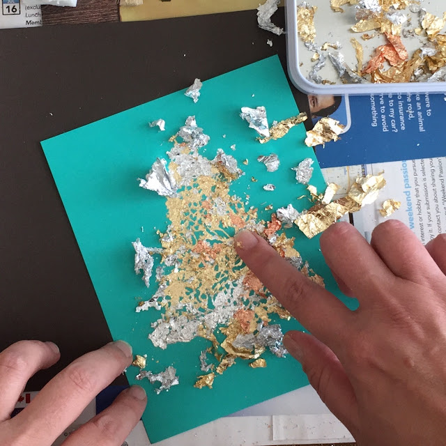 applying the gilding flakes: a mix of silver, gold, copper