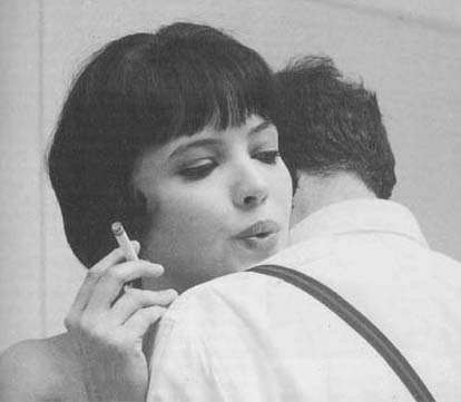 Anna Karina exhaling So with the black and white film ALPHAVILLE 