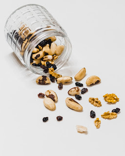 brazil nuts and dried fruit in a glass jar