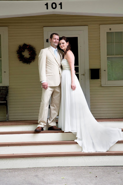 Evie and Josh Leichtenberg wedding photo on front steps of their Sears Elmwood