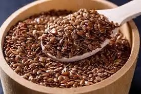 Flax seeds in a wooden bowl , benefits of flaxseed