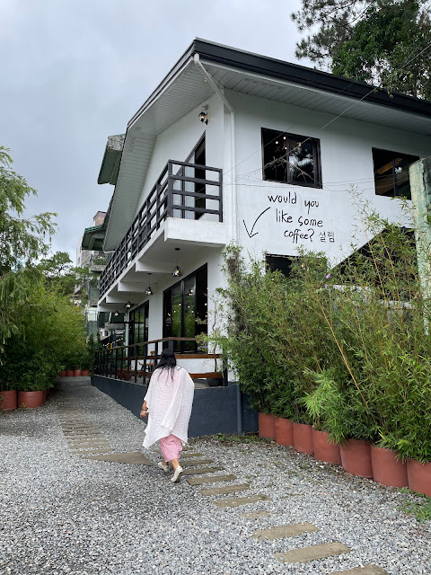 Girl walking to Seollem Cafe, a Korean-inspired coffee shop located in Baguio