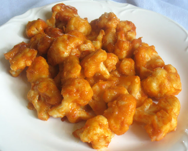 Cauliflower Bites amongst Sriracha Sauce