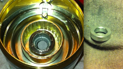 Friction wear on spool housing and badly damaged bushing from Daiwa Emeraldas 2506 INF