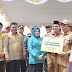 Waki Ketua DPRD Mukhni Hadiri Penyerahan Bantuan Sosial Tunai ke Masyarakat