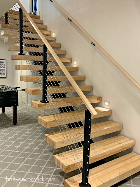 Modern open wood stairs with metal railings 