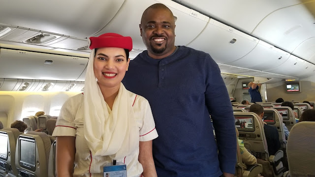 Emirates Flight Attendant and Passenger on plane