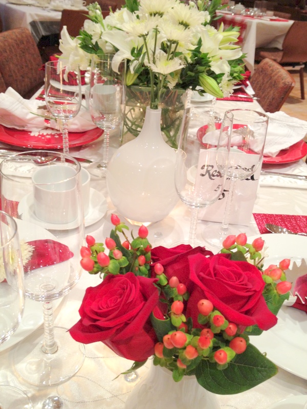 For the main centerpiece a tall cylinder vase was filled with red dogwood 
