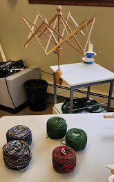 picture of yarn swift, winder and yarn cakes