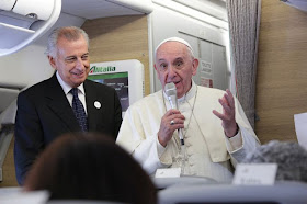 Pope Francis on plane