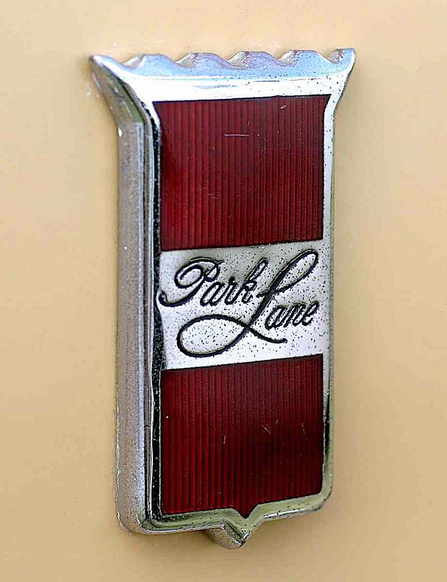 a 1964 Mercury Park Lane car emblem color photograph