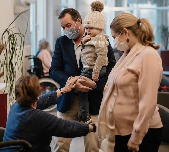 Hereditary Grand Duchess Stephanie wore a silk blouse by Natan. Prince Charles wore a knit cardigan by Tartine et Chocolat