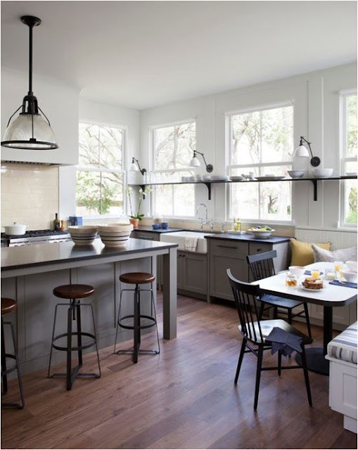 Stunning modern farmhouse kitchen with island and round stools found on Hello Lovely