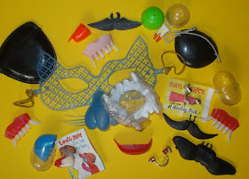A slesction of Novelty trick body parts and injuies from Christmas crackers, joke shops and gum-ball capsule toy machines including a mask and Fake Novelty Body Parts Fingers Eyes Eye-Patches Mustache Teeth Fangs Bloody Nail Claws