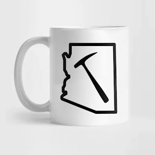 white coffee mug with arizona state silhouette with geology rock hammer