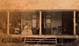 Winifred Rawson tending her son on the veranda of The Hollow, near Mackay, Queensland, ~1873