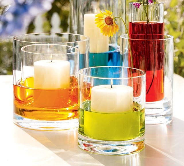 eye-catching-unique-wedding-centerpieces-ideas-with-candle-in-glass-and-colorful-liquid
