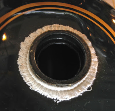 Elastic sock top around gas filler opening.