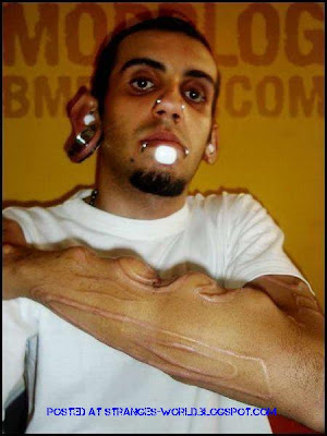 Horrible body piercing @ strange world