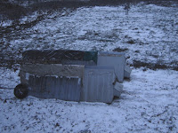 Snow building as night falls on the coops