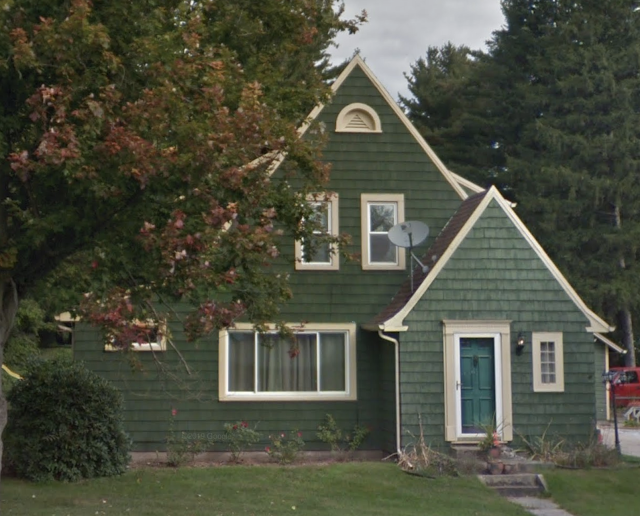 front view color photo of green house, Sears Cedars model, 3511 W Johnson Road, La Porte, Indiana