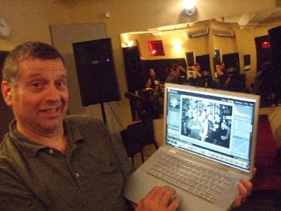 Tony with MAC book (his pride and joy!)  Please note band rehearsing in the mirror