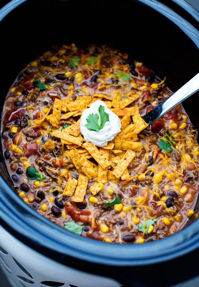Crock Pot Taco Soup is my idea of the best comfort food this time of year. It’s full of delicious beans, corn, ground beef and wonderful taco seasoning! 