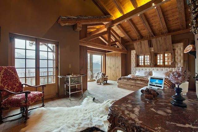 Picture of another bedroom with wooden furniture and the balcony