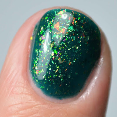 green flakie nail polish close up swatch