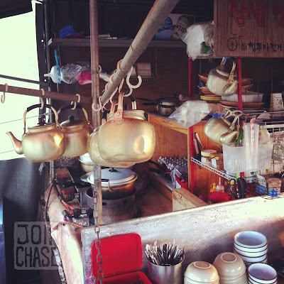 Kettles, pots, and dishes inside a makgeolli truck in South Korea.