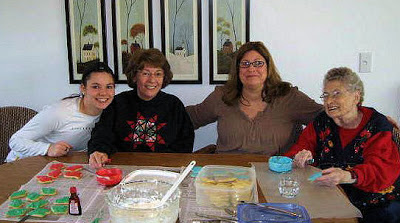 My daughter, mother, me, and my grandmother decorating cookies.